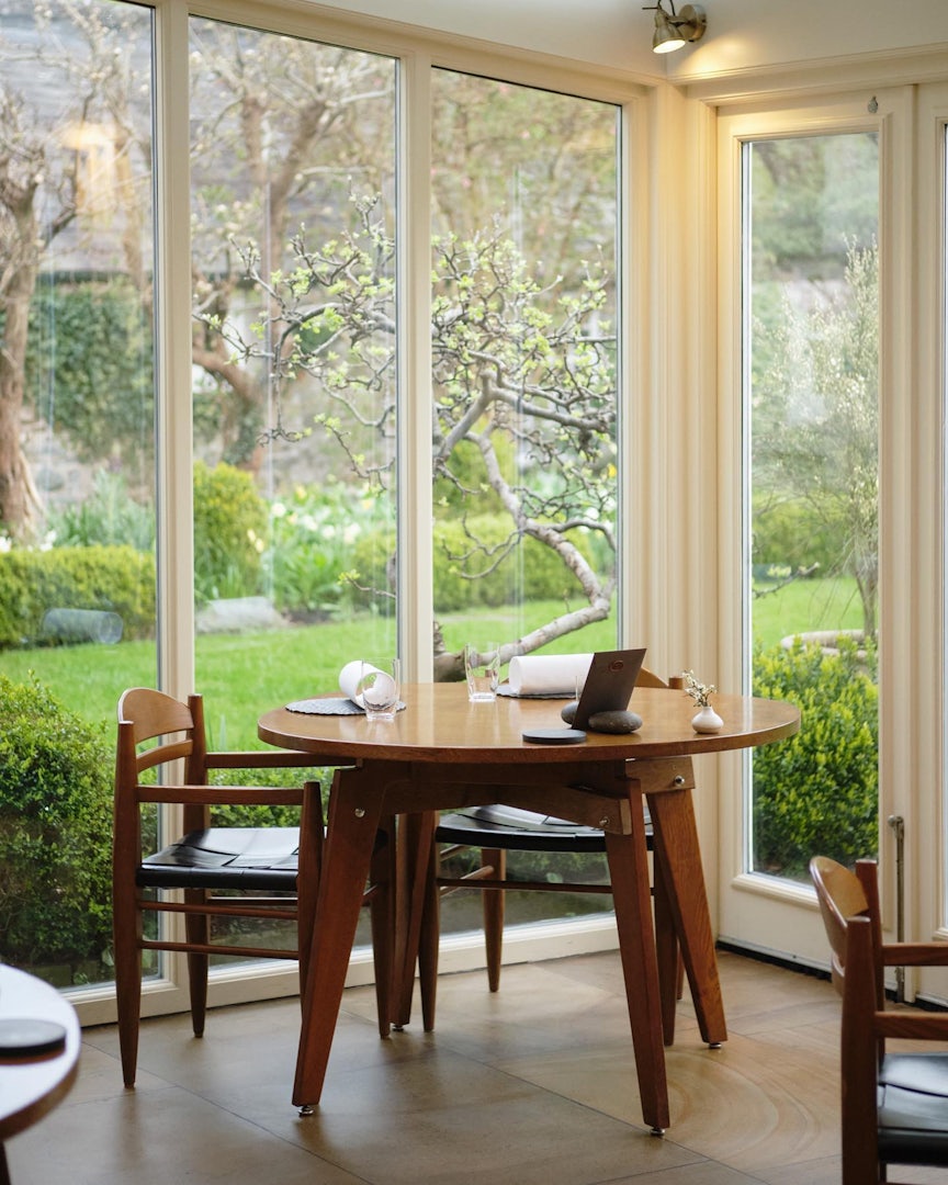 Dining table with a view of the garden at L'Enclume