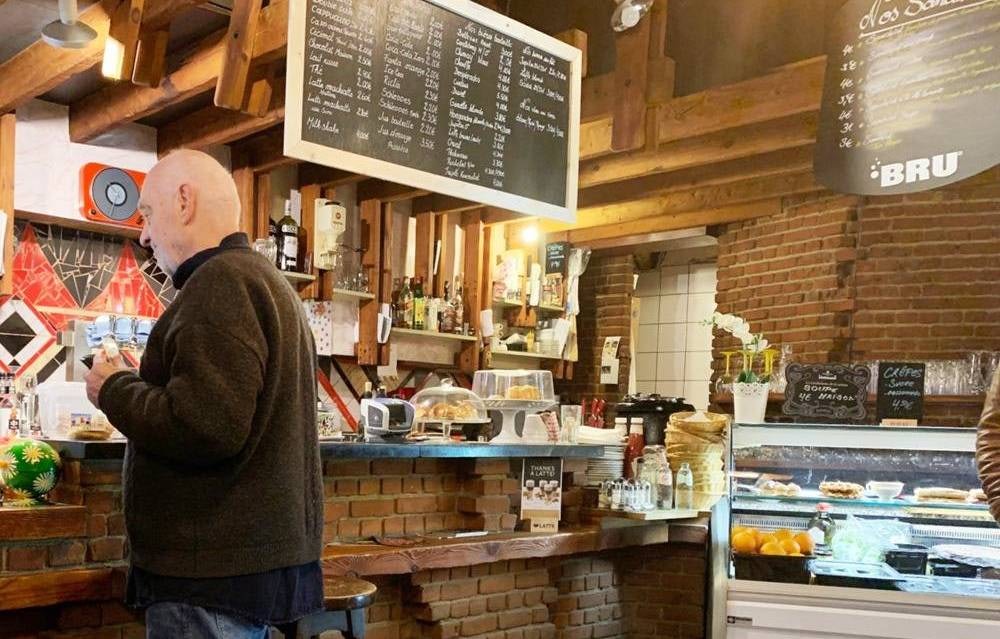 a cozy and warm interior of Le Cappuccino 1971 coffee bar