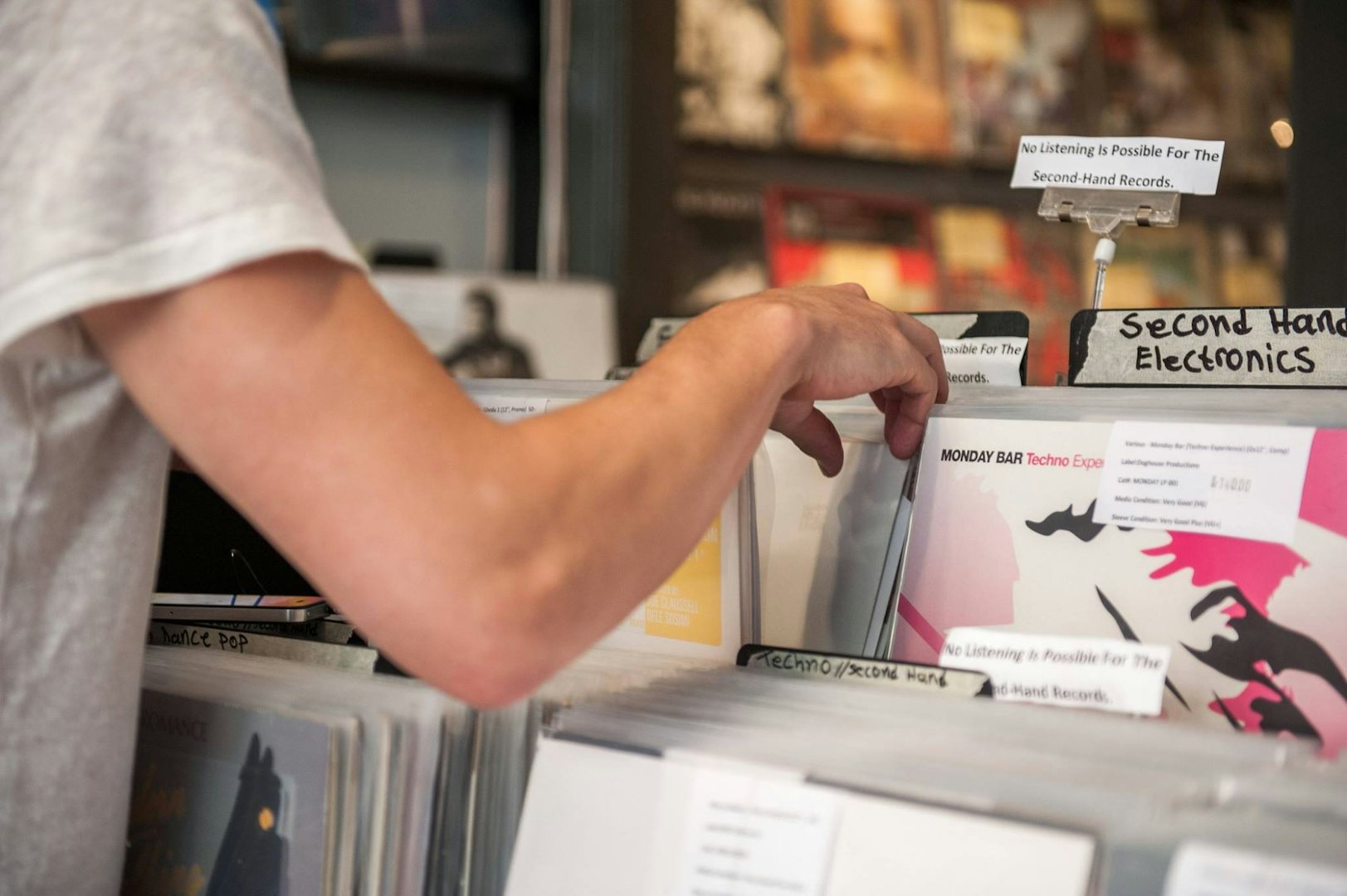 A man looking through records at Fade Records