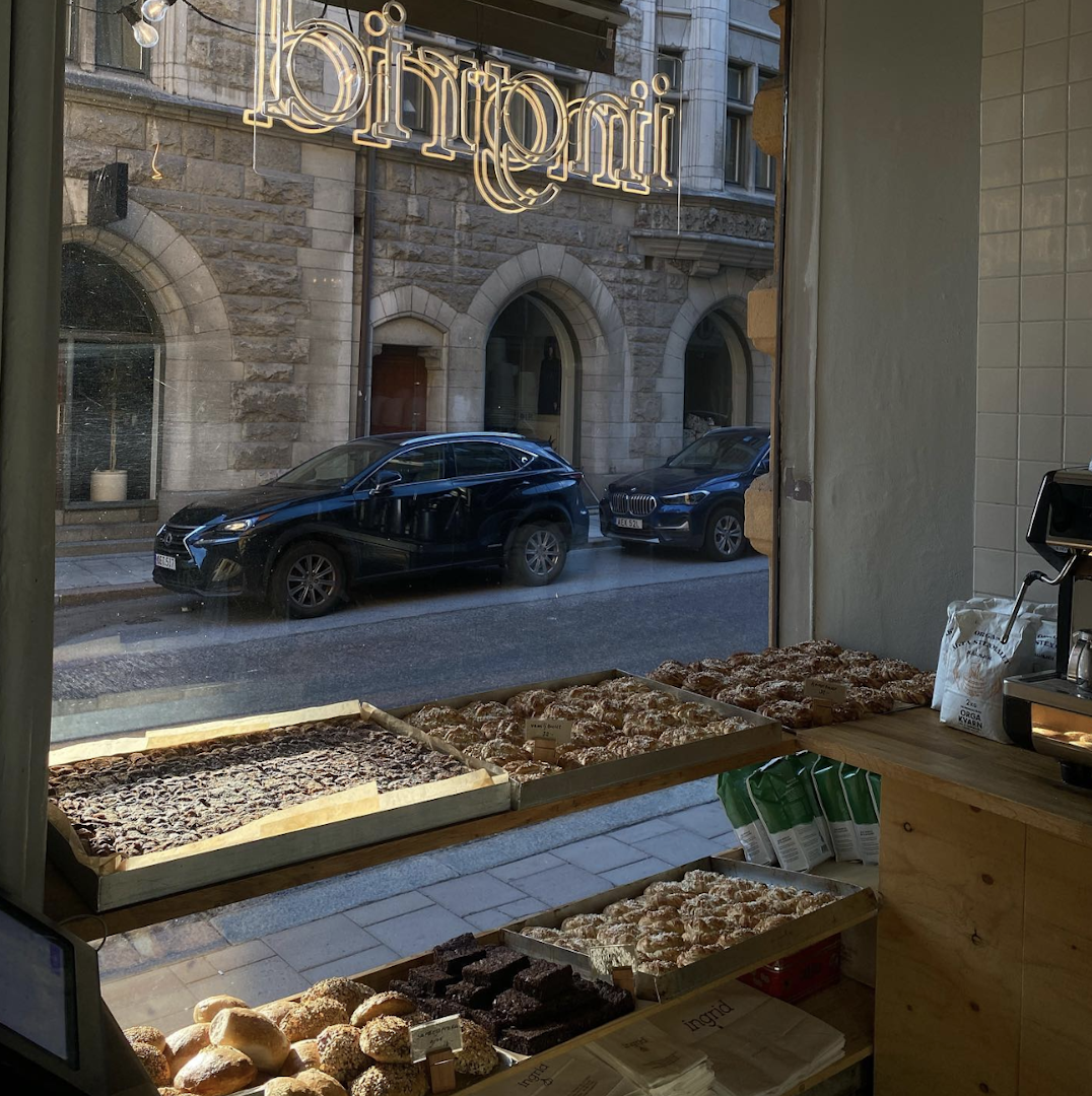 A neon sign and baked buns at Ingrid bakery in Stockholm