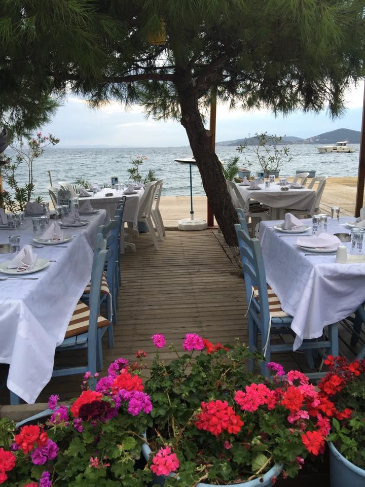 Tables with white tablecloths on Teos Kinaliada in Istanbul