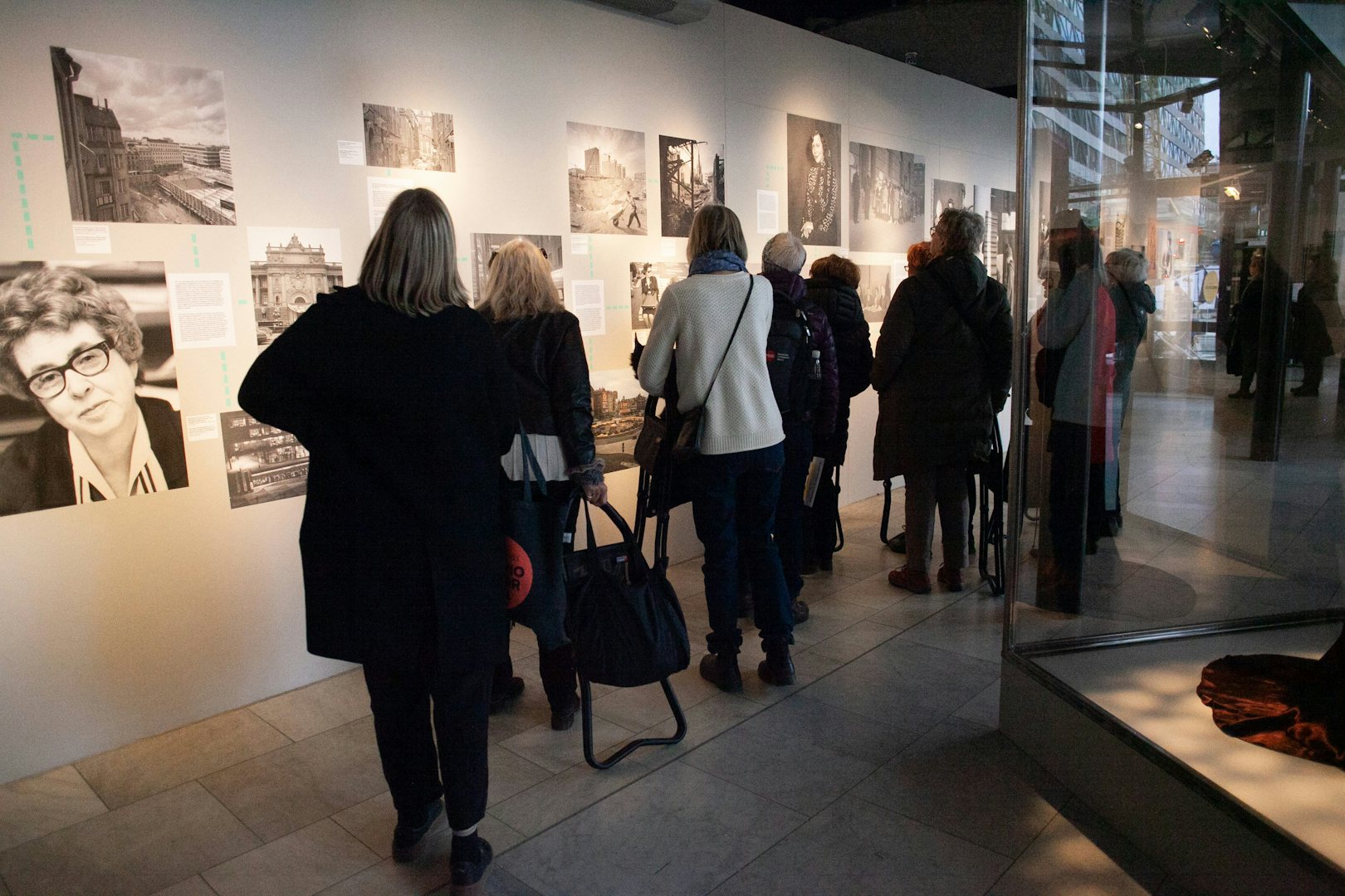 People looking at an exhibition organised by Kvinnohistoriska museum