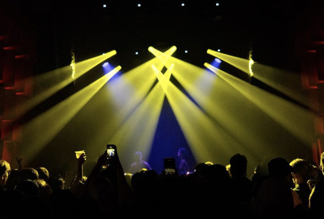 Yellow spotlights and people dancing at Frankhan