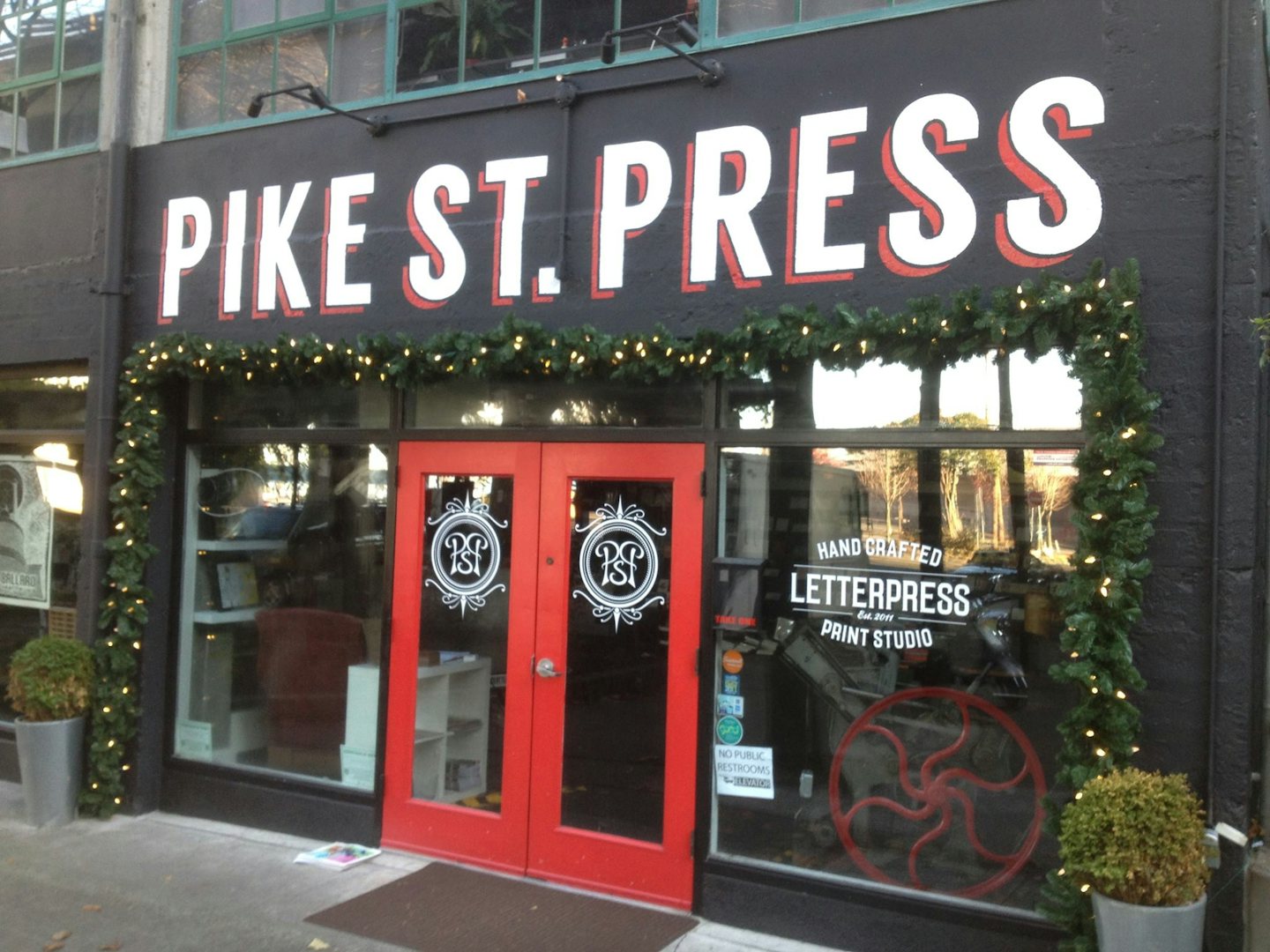 Facade with painted letters of Pike St Press shop