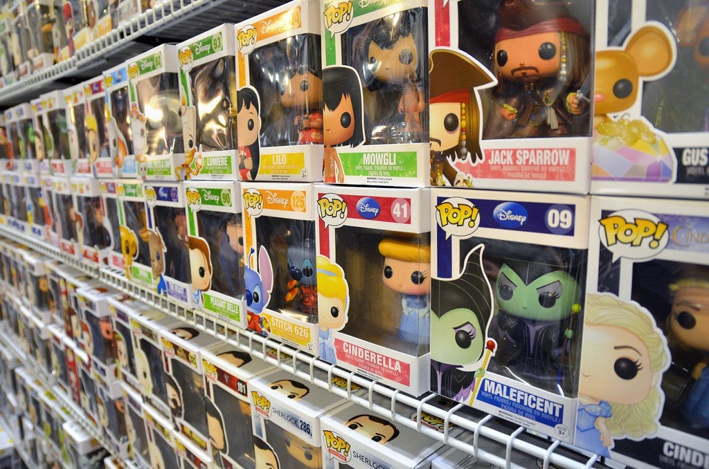 Rows of Funko Pops dolls on shelves 