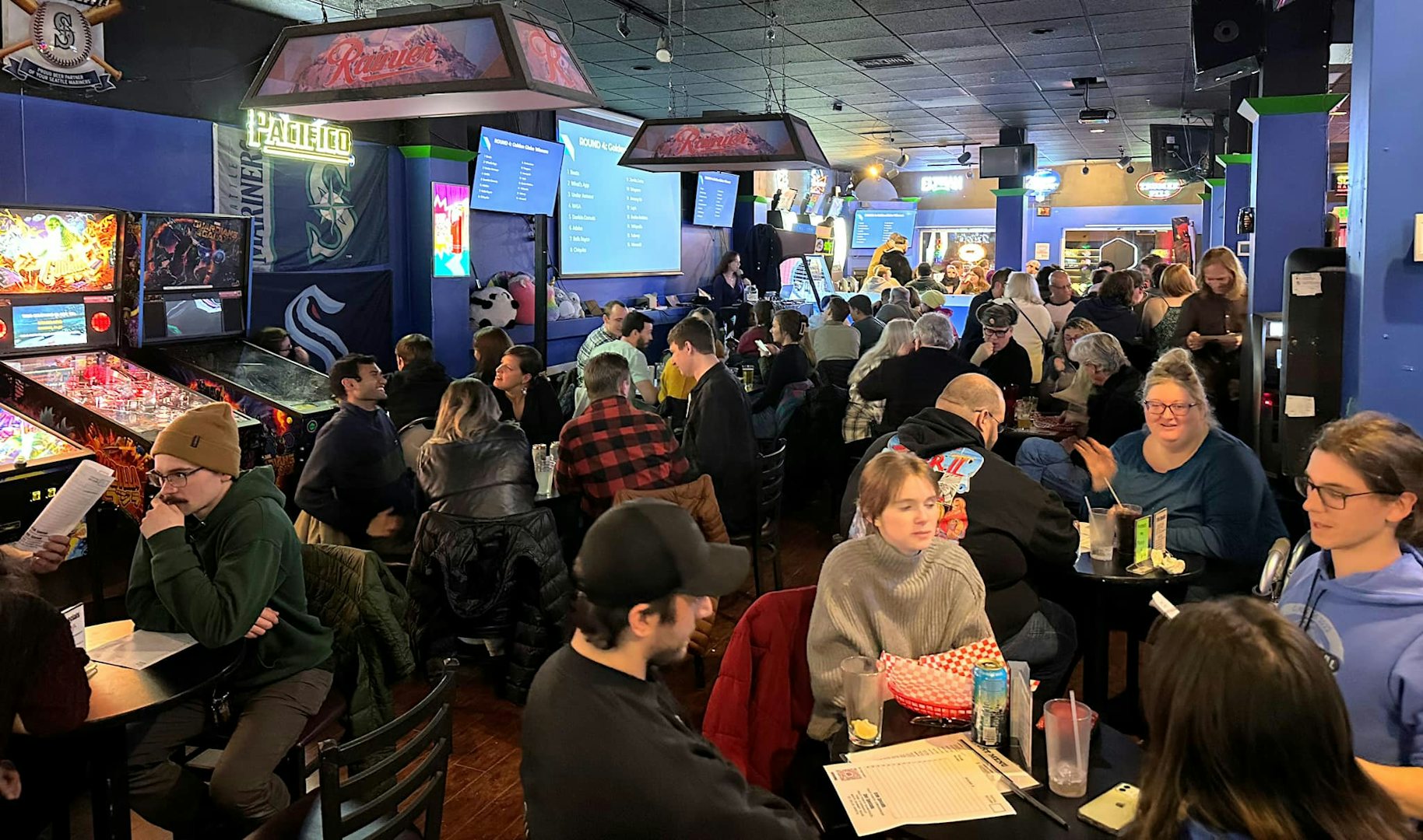 People sitting at tables and drinking at Admiral pub sports bar