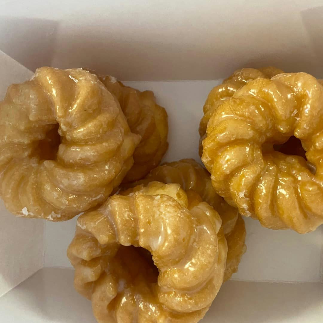 Krullers stacked in a box from Good Day Donuts