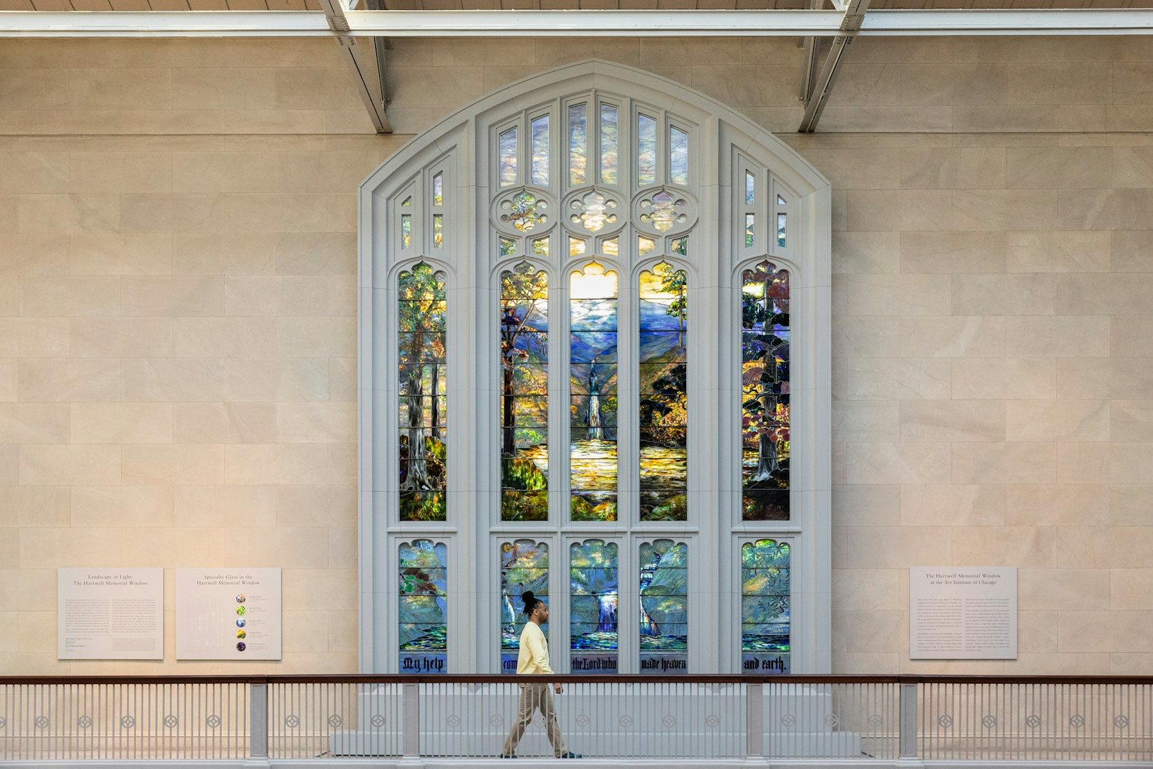 a man walking by an artwork in the Chicago Art Institute