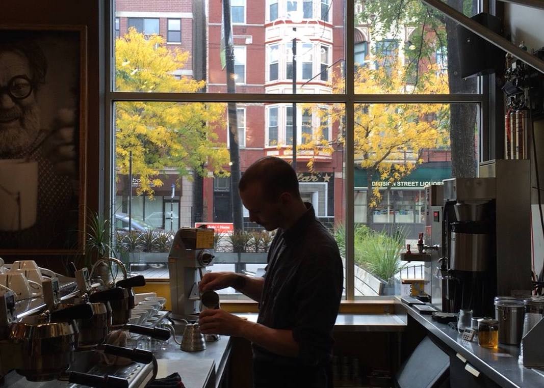 the barista preparing a coffee at Caffè Streets in Chicago