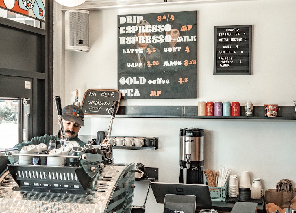 barista preparing coffee at Four Letter Word Chicago 