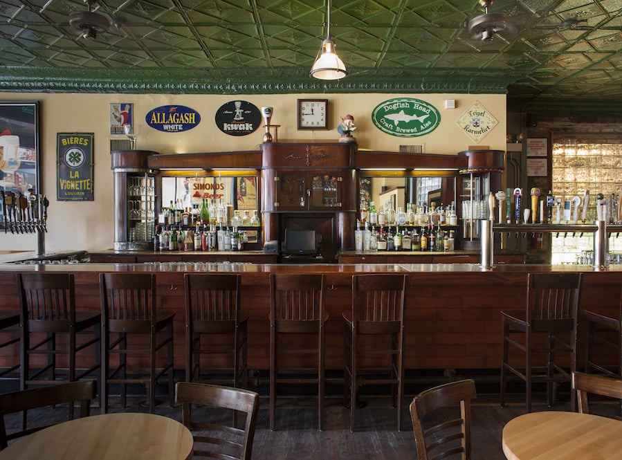 green and wooden pub interior of the Hopleaf Bar 