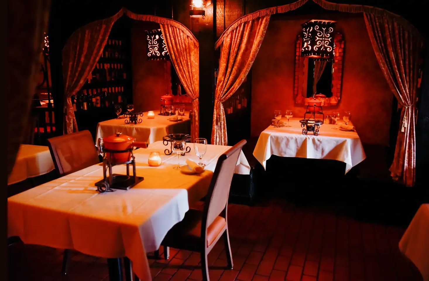 a warm-lit setting at Geja's Cafe Chicago
