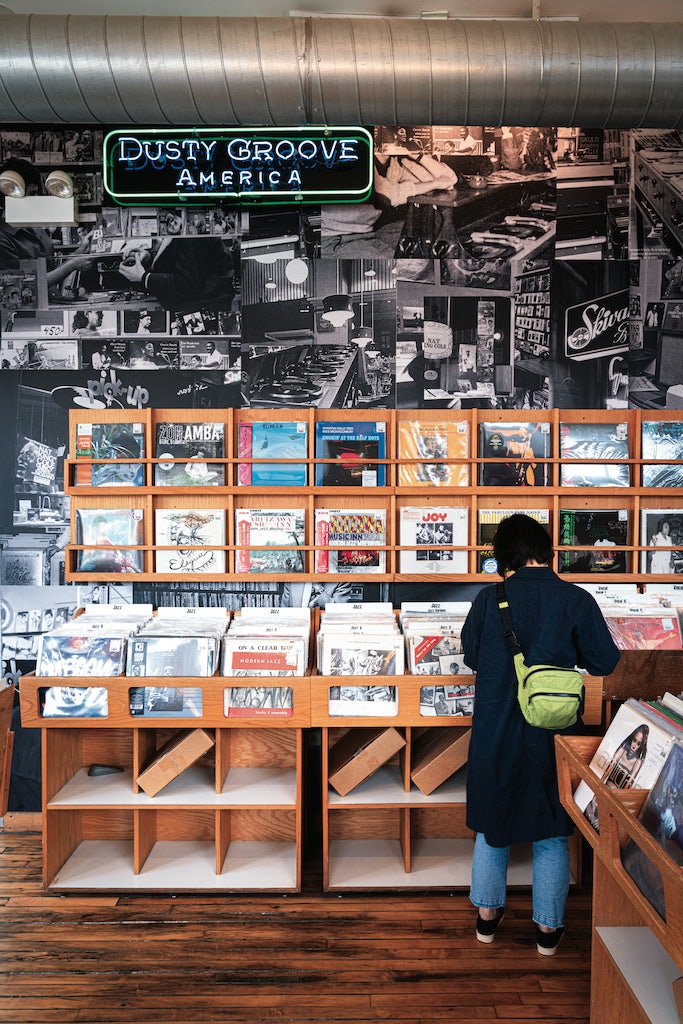 woman searching through vinyls at Dusty Groove record shop