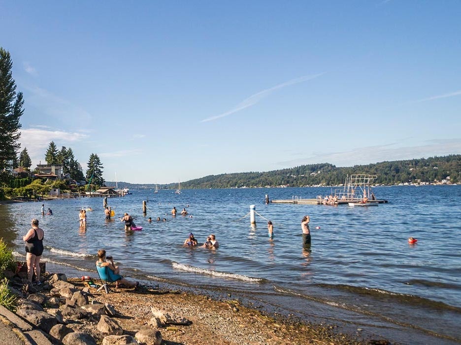 people enjoying a swim at the Matthews Beach Park