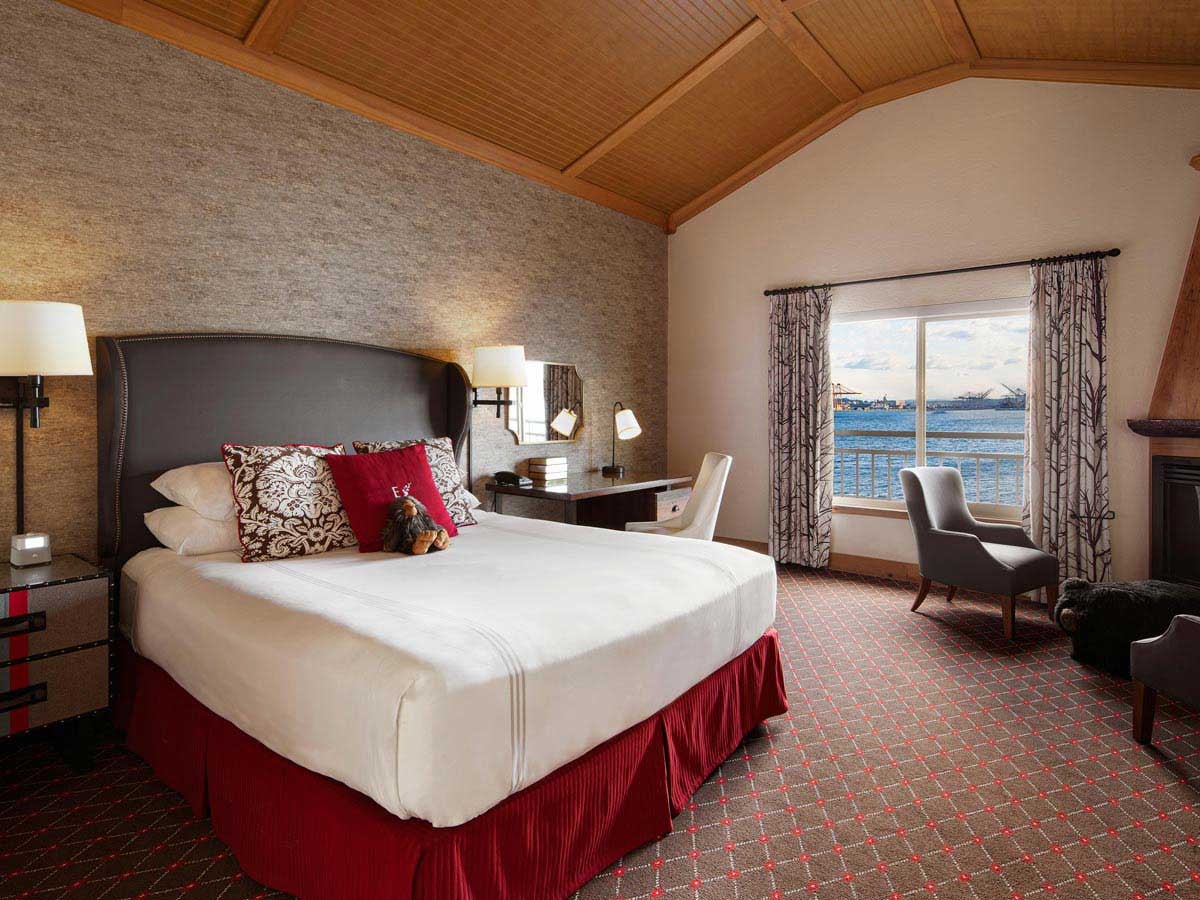 a cozy room with water view at the Edgewater Hotel
