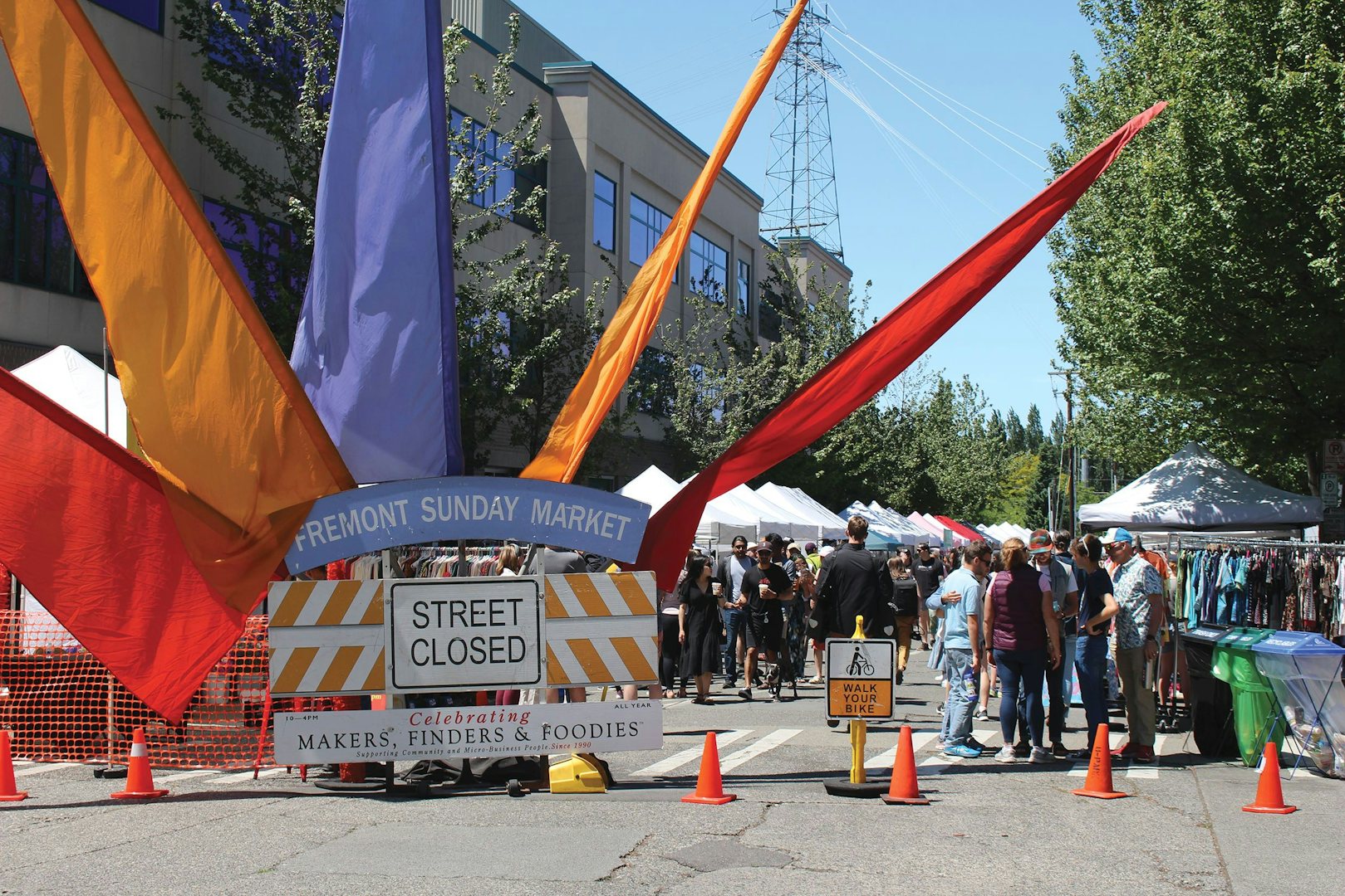 Flags and sign marking Fremont Sunday Street Market