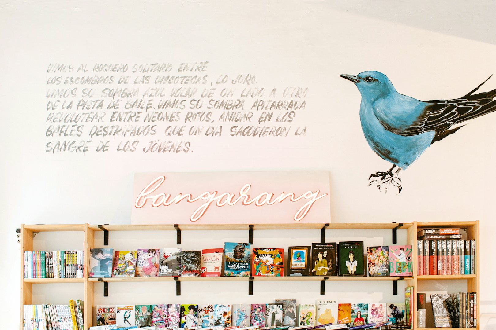 beautiful mural of a bird and a quote in the wall of Bangarang book shop