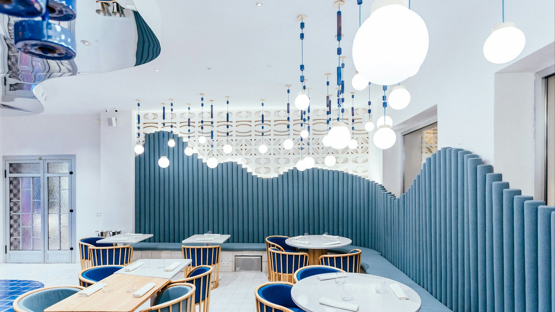 Blue and white interior of La Sastreria in Valencia