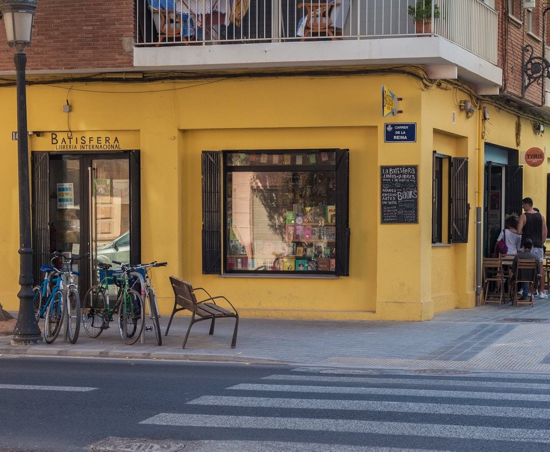 yellow shop facade of La Batisfera bookshop in Valencia