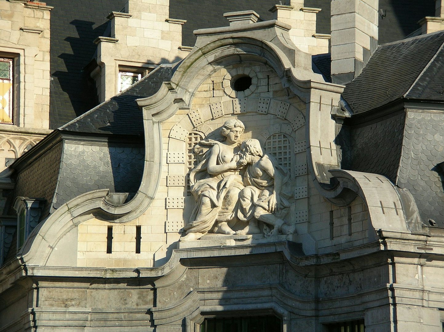 statue of woman breastfeeding a man in Ghent