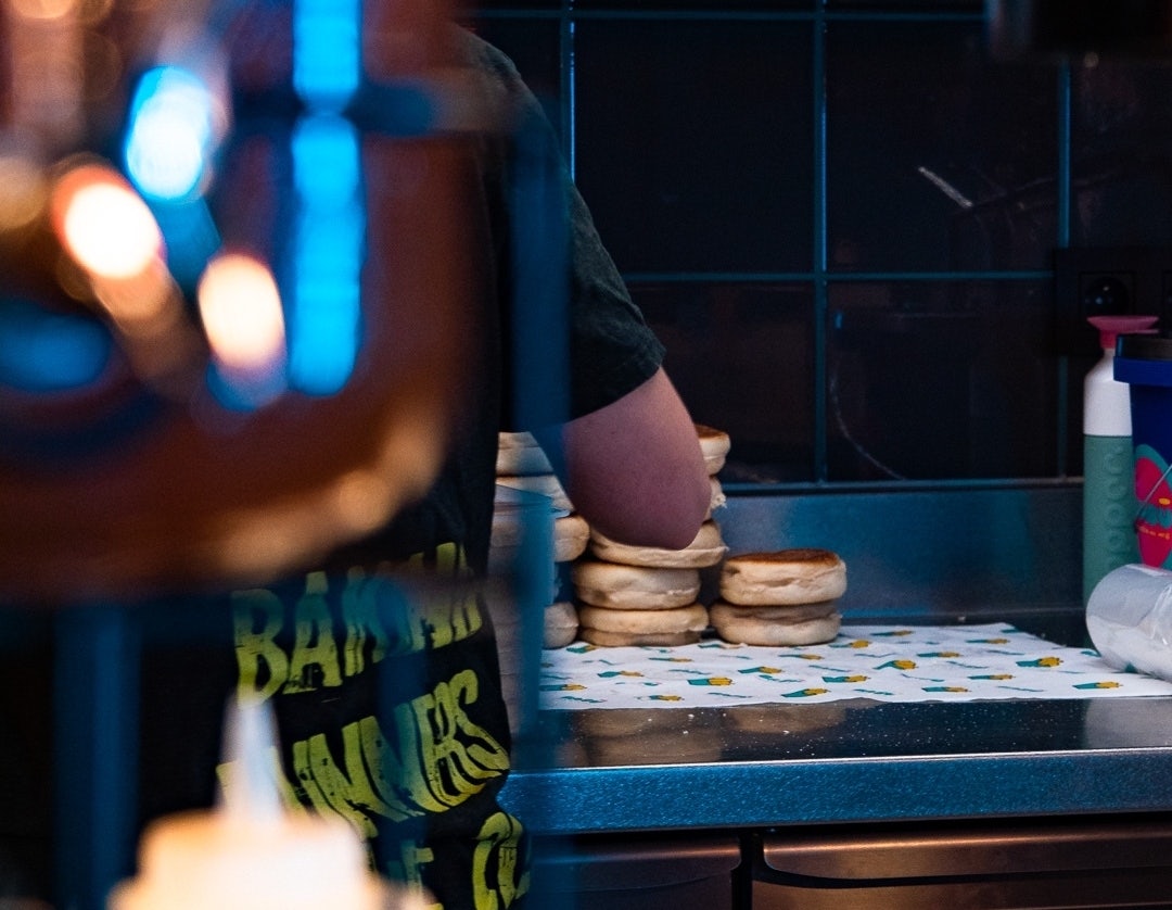 a man preparing buns at Babu Ghent