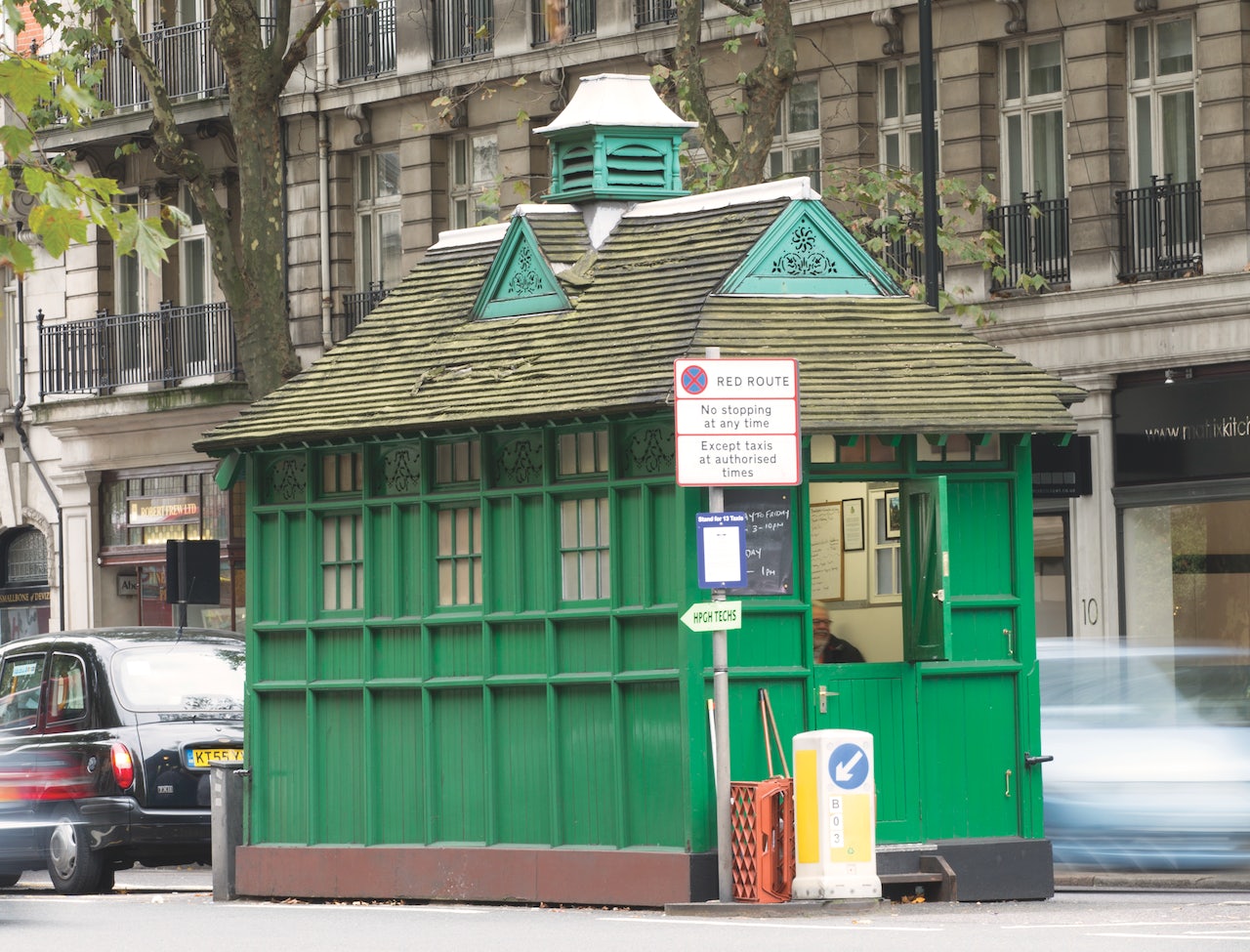green distinctive shed for taxi drivers in London