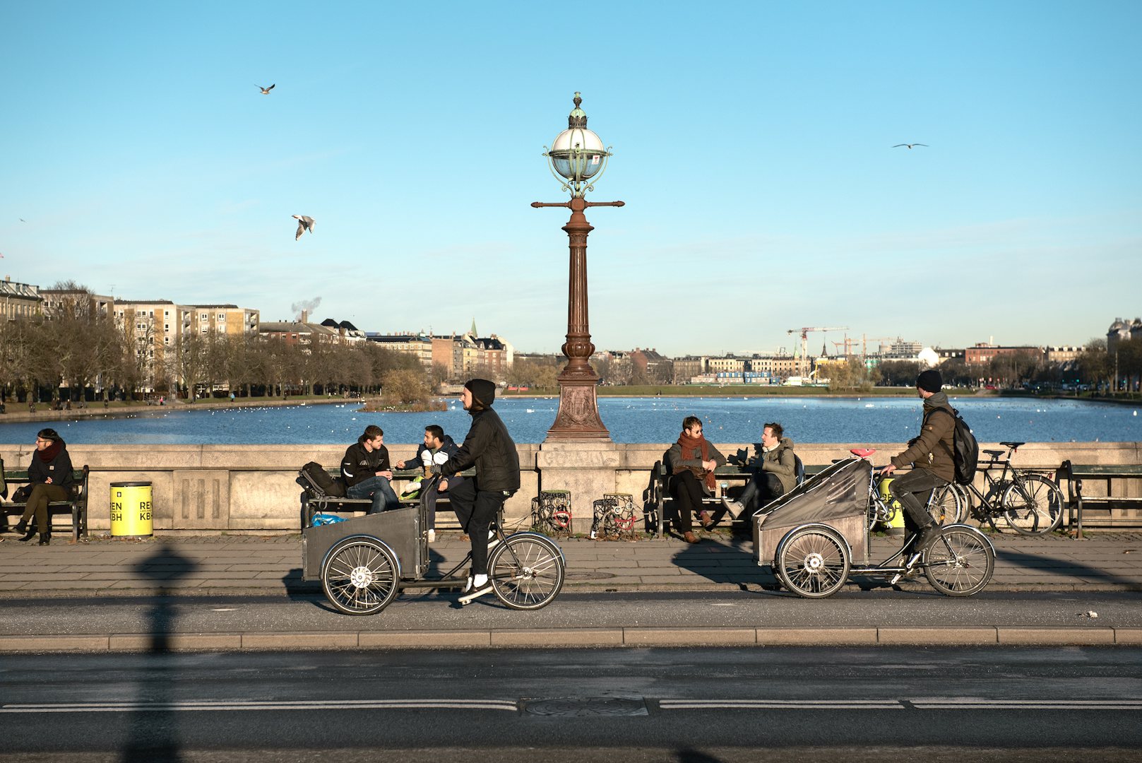 people drinking on a bridge in Copenhagen and enjoying the view