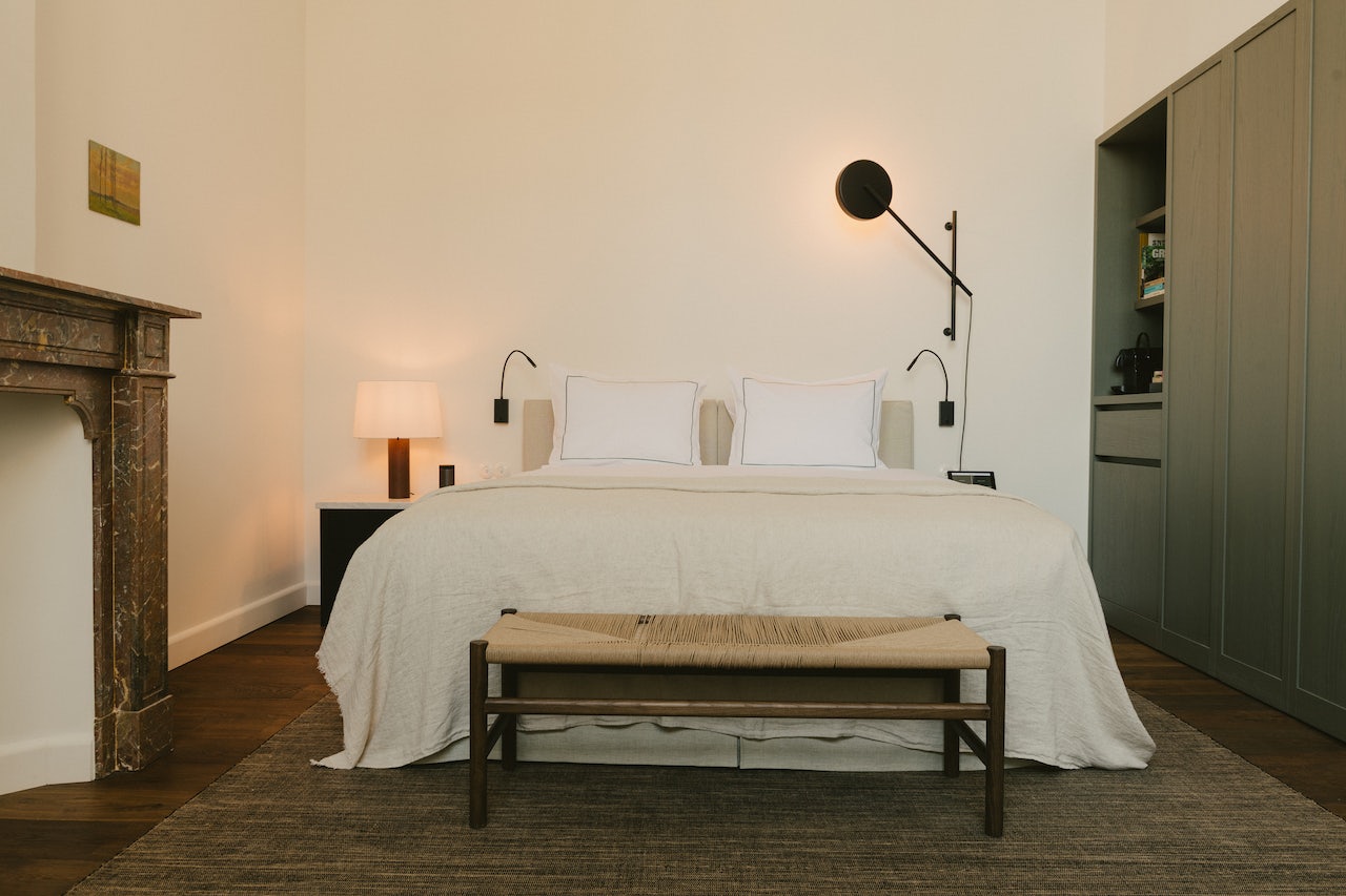 warm and cozy interior of bedroom at August Hotel