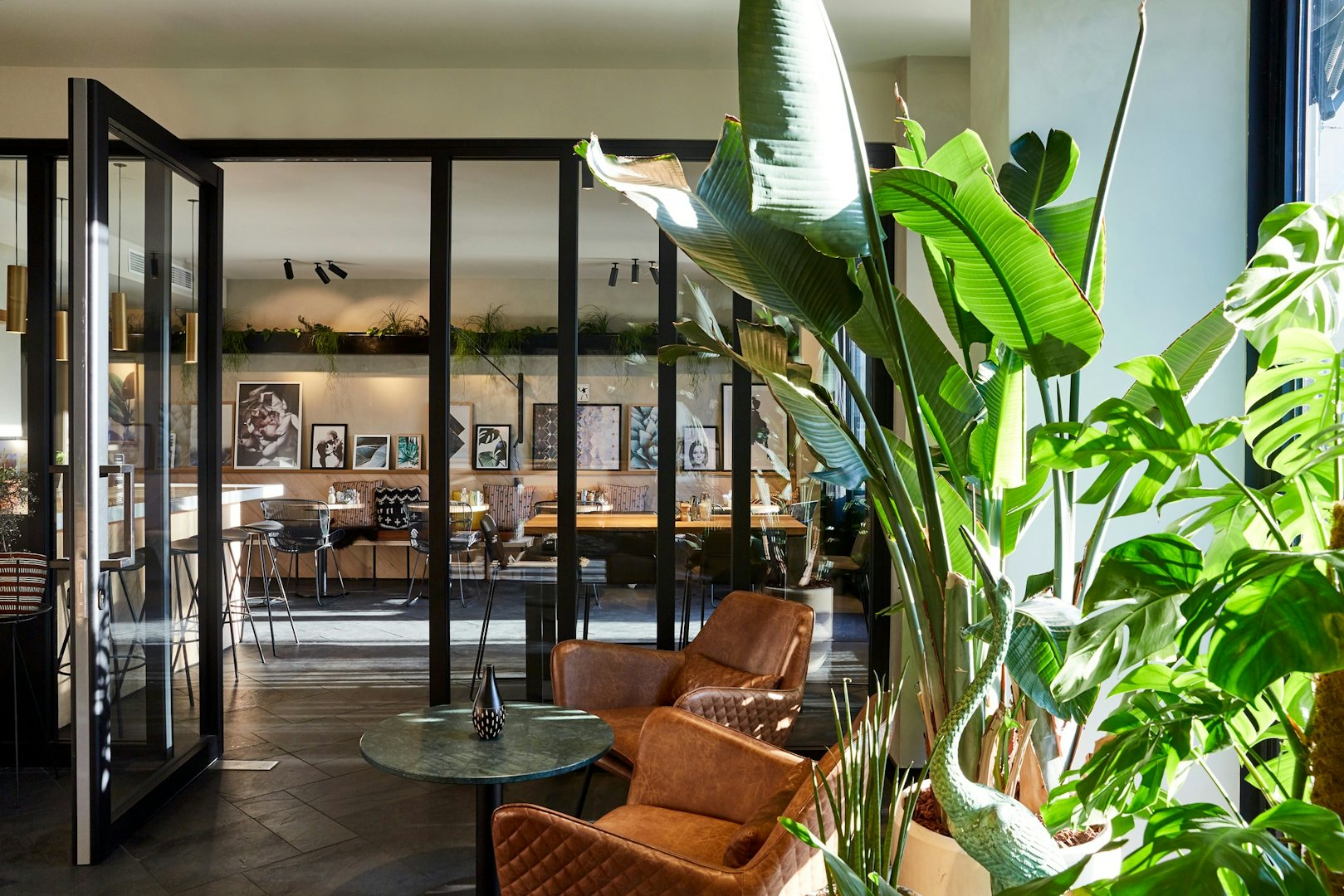 Modern decor and lots of plants at Hotel Lobby of Hotel Indigo in Antwerp
