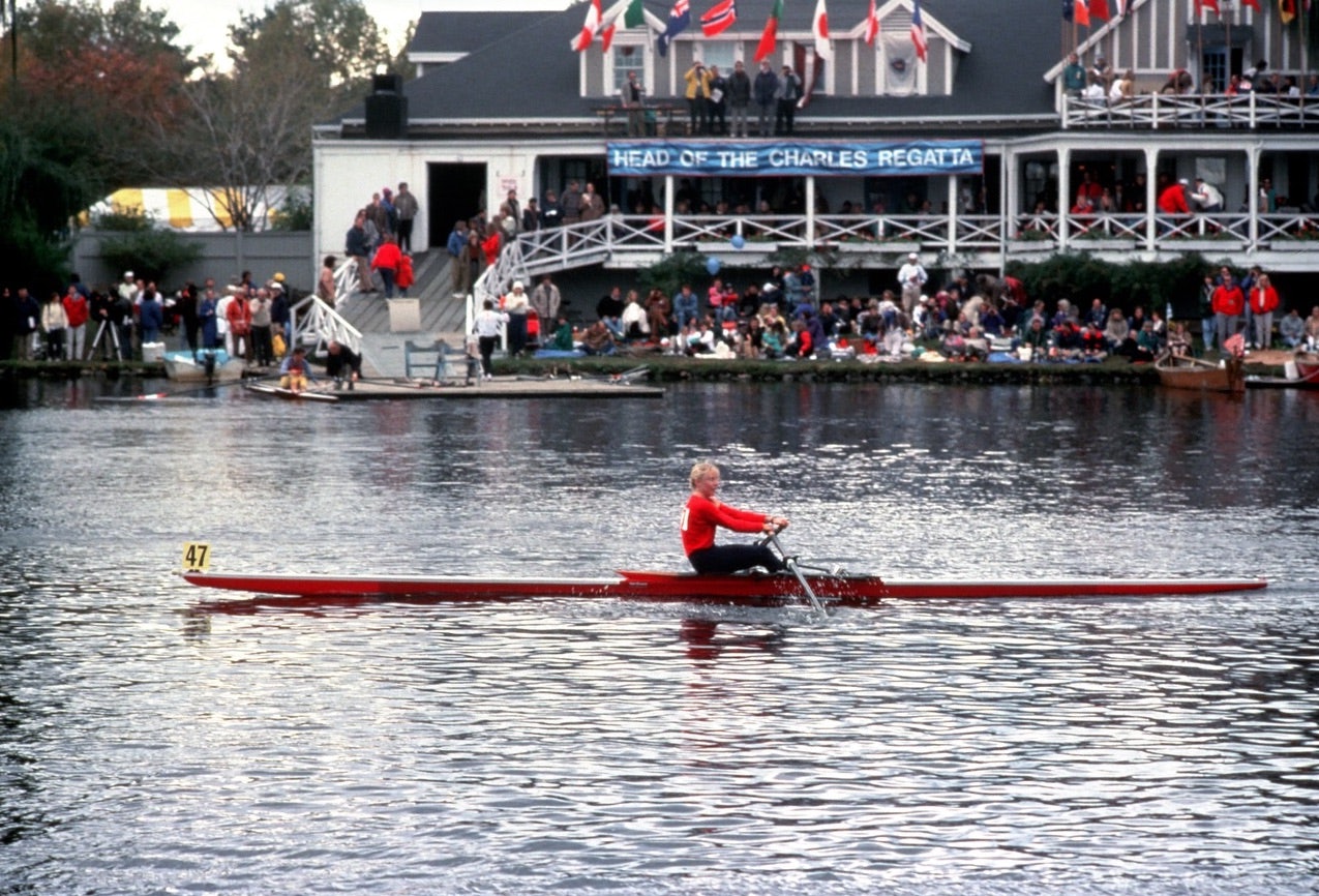 a woman rowing at the Head of the Charles Regatta