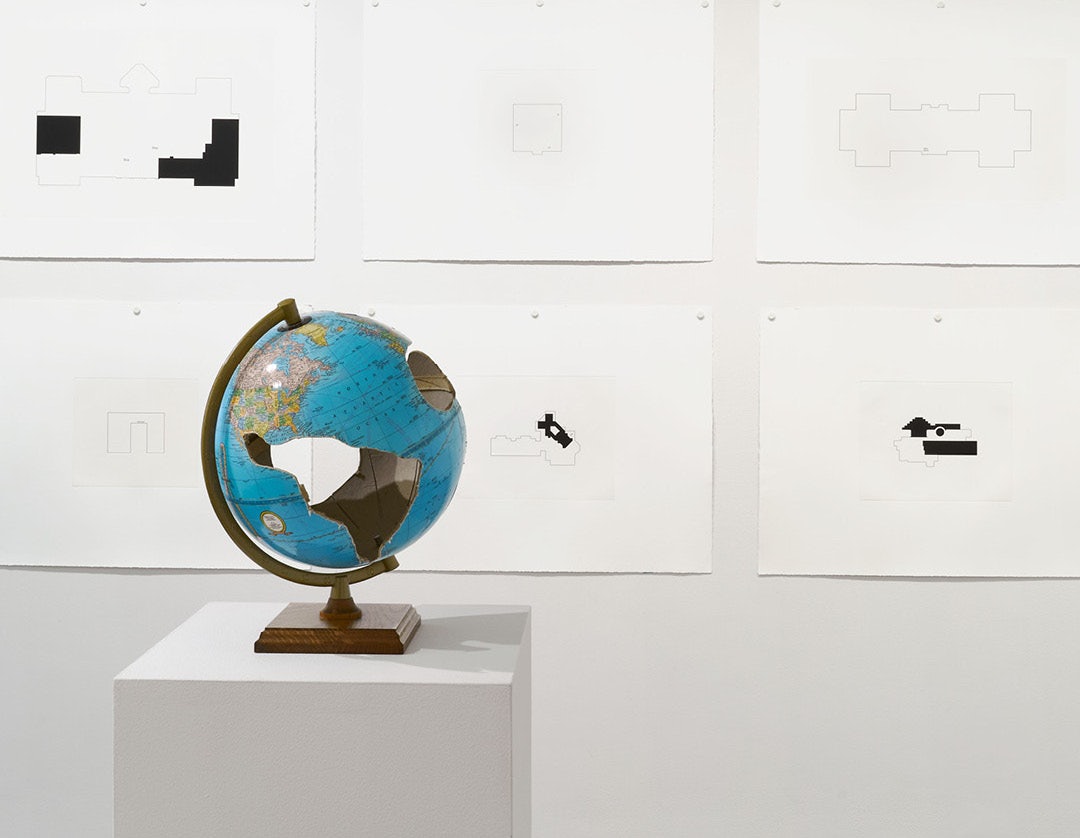 art and a world globe displayed at the Krakow Witkin Gallery