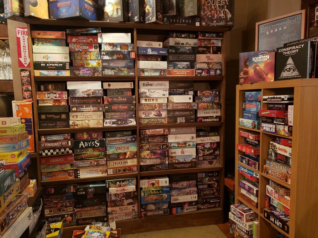 a bunch of boardgames at Knight Moves Cafe