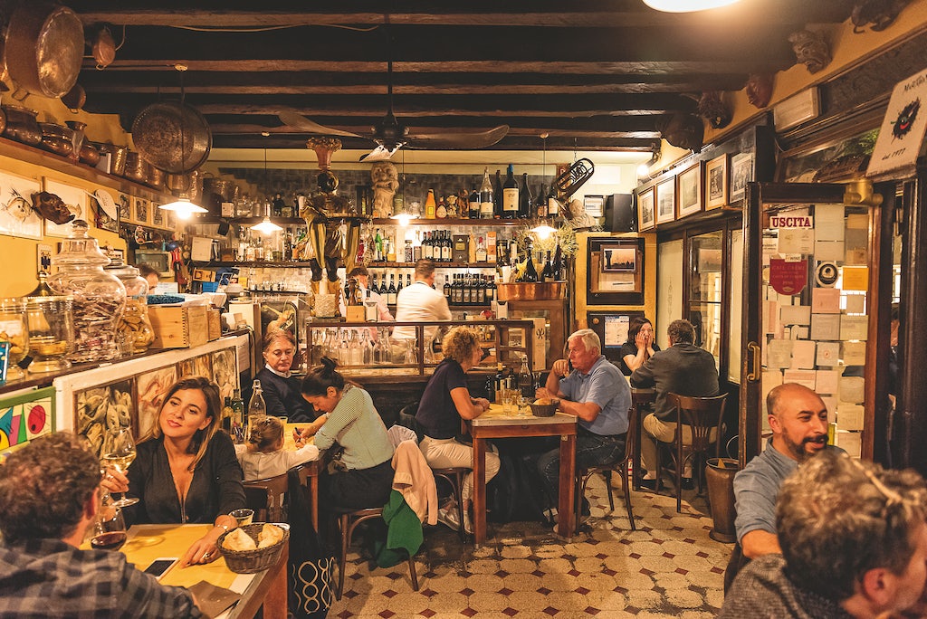 people enjoying dinner at Al Mascaron