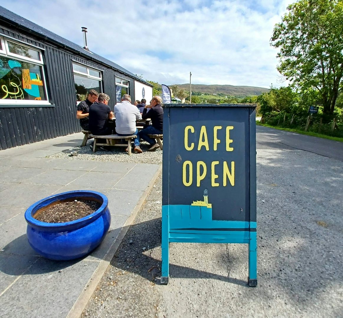people enjoying a drink outside Cafe Lephin