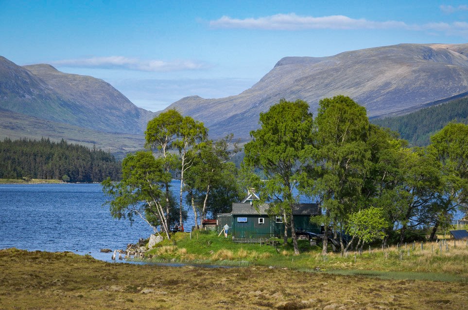 The Loch Ossian Youth Hostel by the lake and against a stunning Scottish landscape