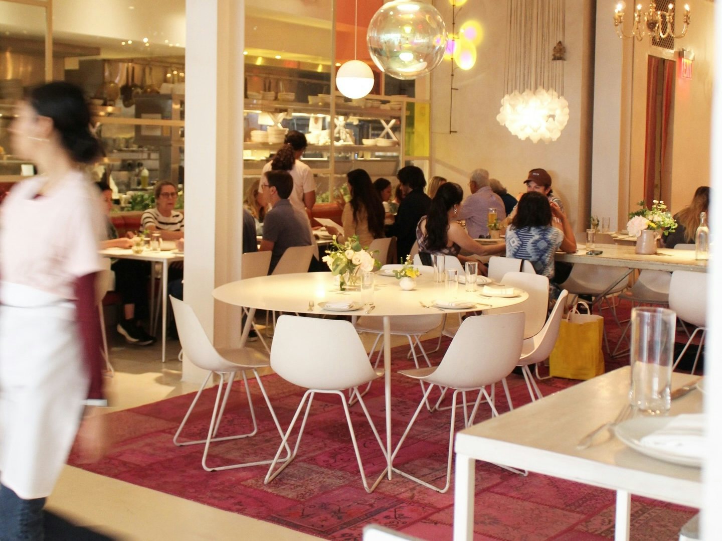 interior and vibrant crowd at the ABCV restaurant in NY