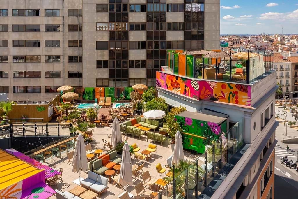colorful rooftop bar and swimming pool at Generator Madrid